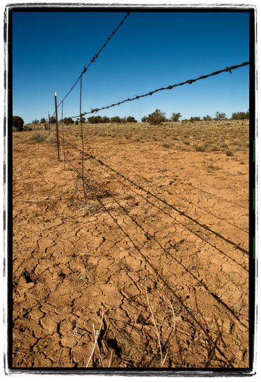 Cracked-Earth-And-Barbed-Wire-For-Miles.jpg