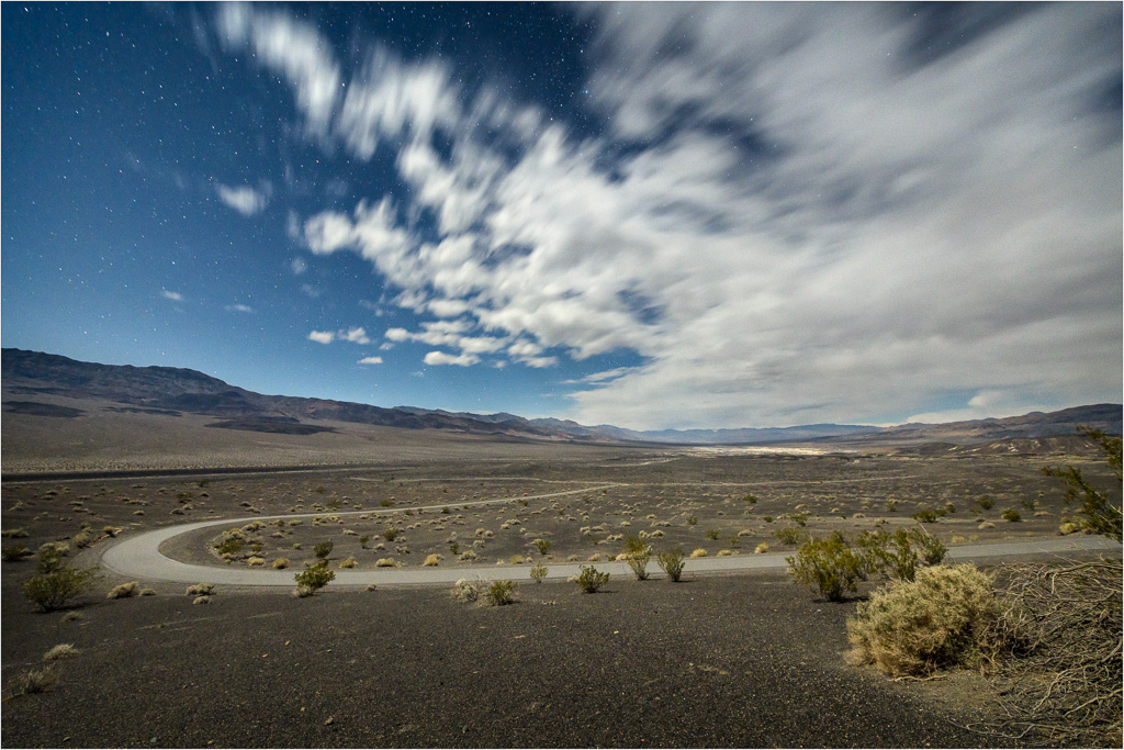 A-Rush-Of-Clouds-Over-Winding-Desert-Roads.jpg