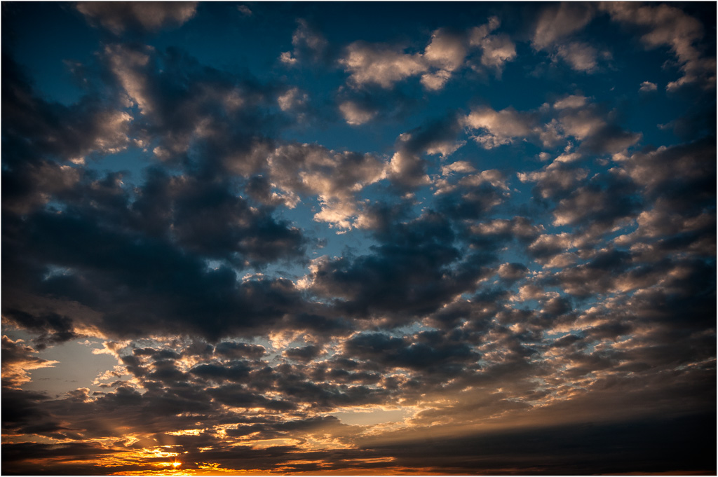 Setting-Sun-In-An-Explosion-Of-Clouds.jpg