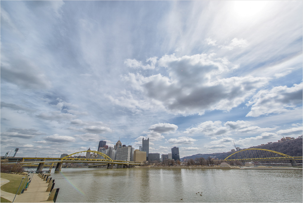 Springtime-Clouds-And-Rainbow-Lensflare.jpg